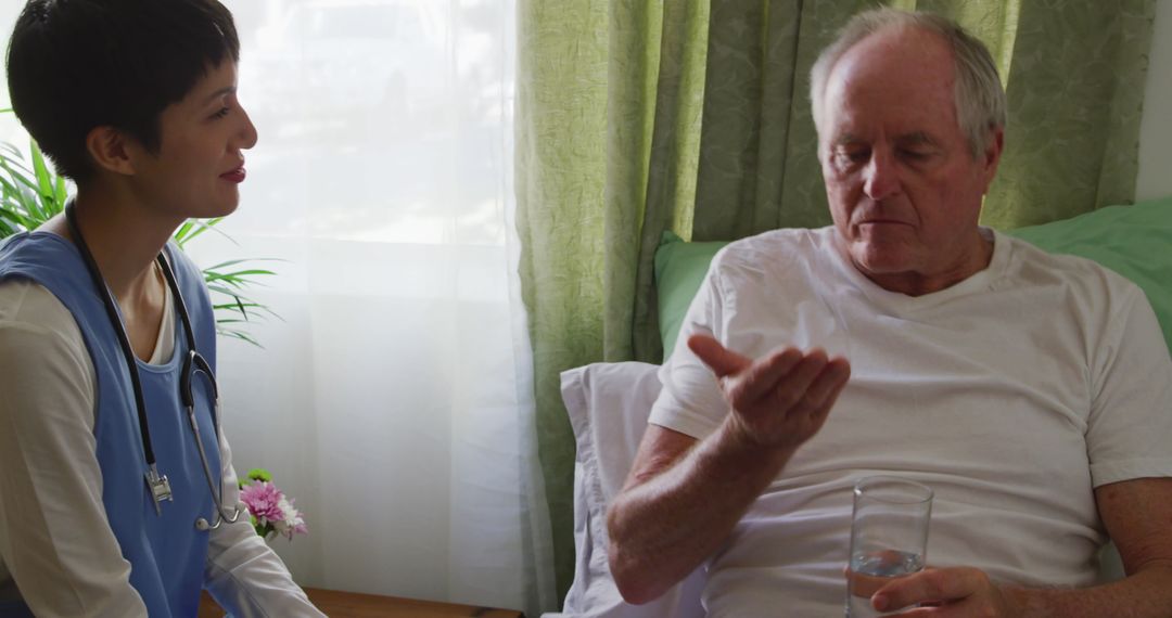 Healthcare professional assisting senior with Medicare coverage